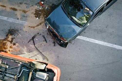 pieces of glass scattered on the streets after a car accident