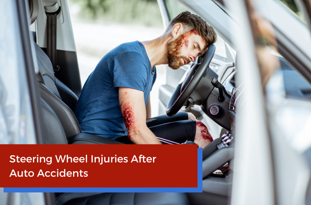 injured man on a steering wheel after a car accident